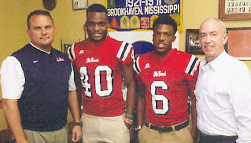 DAILY LEADER / Photo Submitted / Brookhaven head football coach Tommy Clopton was a guest speaker for the Brookhaven Servitium Club meeting Wednesday at Poppa's Fish House. Pictured with Clopton (left) are Dandy Dozen player Leo Lewis (40), running back Trey McDaniel (6) and club president Shannon Aker.