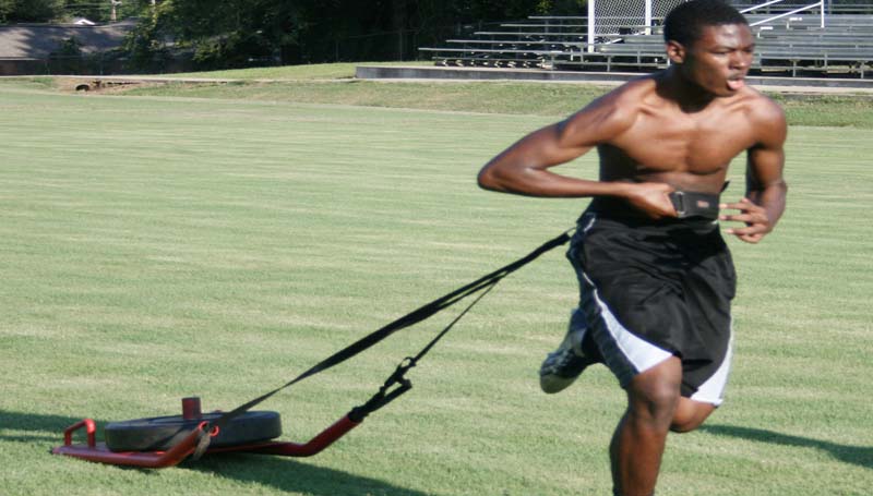 DAILY LEADER / MARTY ALBRIGHT / Bogue Chitto's Sherman Jackson works on his conditioning and speed while pulling a weighted sled.