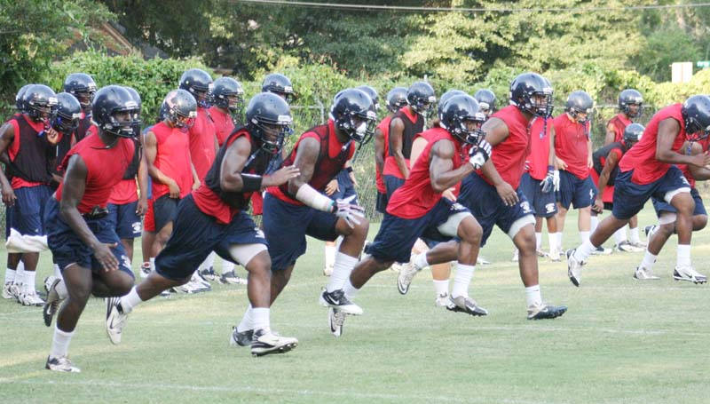 DAILY LEADER / MARTY ALBRIGHT / Brookhaven High seniors lead their football team in a series of sprints to get stronger and faster for the upcoming season. The Panthers kickoff the season Aug. 15, in a jamboree at Pearl.