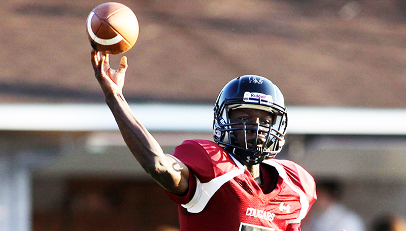 Lawrence County Quarterback Jerrod Barnes runs for extra yardage against Franklin County Friday evening.