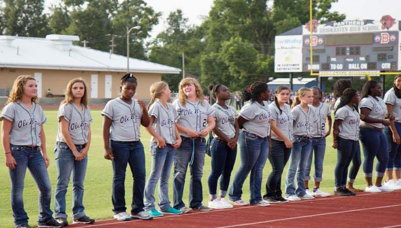 DAILY LEADER / Photos SUBMITTED / Brookhaven High hosts a Meet the Panthers Monday. Friends and families gather to welcome in the new season. In the top photo, Brookhaven's softball teams lineup along the track on King Field to be introduced. In the left photo, the Panther cheerleader mascot provide some excitement and they pump up the fans.