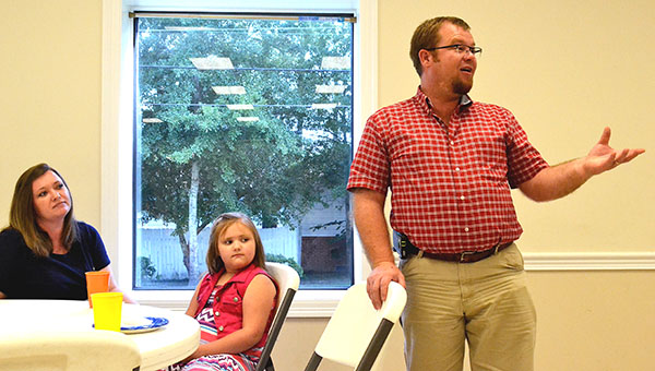 Also speaking about his daughter's Make-A-Wish trip was Jonathon Sasser, as Wish recipient Anna Jo, 6, and mom, Shana Sasser listen. The families' testimonials were part of Tuesday night's local Make-A-Wish fund drive kickoff.
