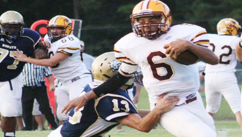 DAILY LEADER / MARTY ALBRIGHT / Enterprise's Chance Lacking (6) tries to get away from Bogue Chitto tackler Kobe Roberts (13) in Thursday night's football action.