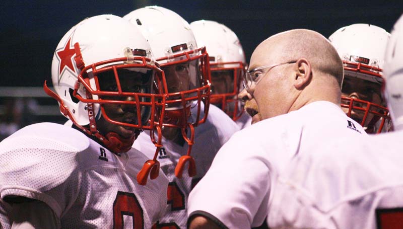 DAILY LEADER / MARTY ALBRIGHT / Loyd Star coach Adam Cook talks to his players during a timeout Friday night.