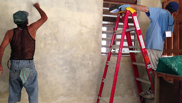 PHOTO SUBMITTED / Belize residents help Faith Presbyterian Church missionary volunteers repaint and renovate Shalom Church in Belize.