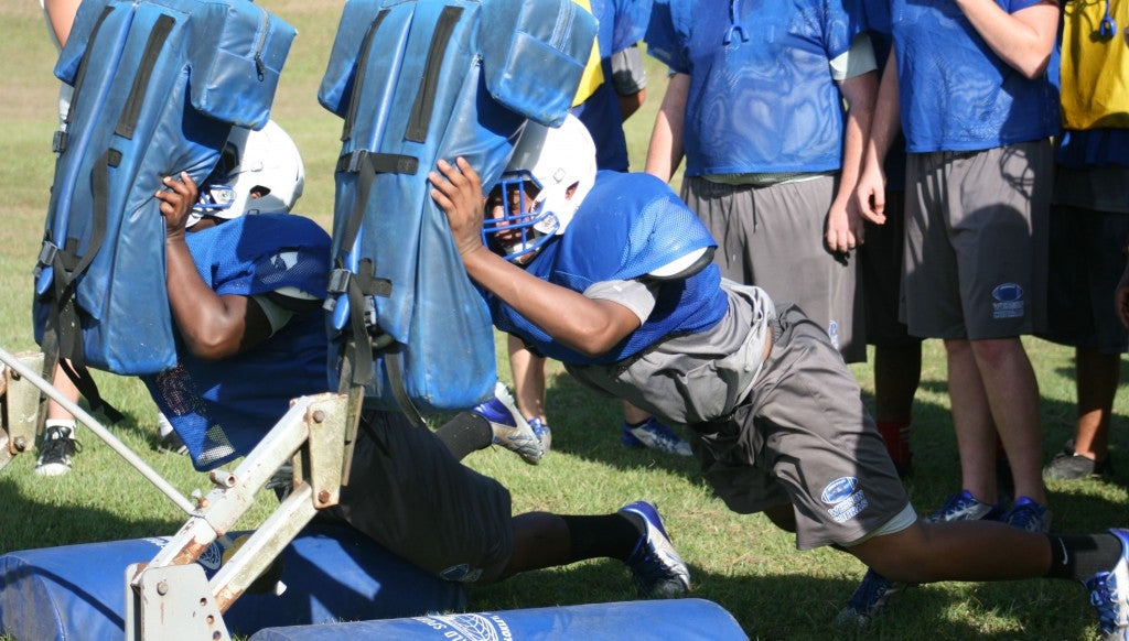 Wesson's Jamarcus Petterson practices his blocking skills while hitting the sled. The Cobras will be in action Friday as they prepare to travel to Bogue Chitto to take on the Bobcats in jamboree. Scrimmage starts at 7 p.m.