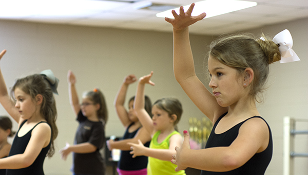 DAILY LEADER / KATIE WILLIAMSON / Riley Ray, 7, and classmates practice (right). Registration for classes remains open until Aug. 31. Contact the Rec Department at 601-833-3791 for more information.