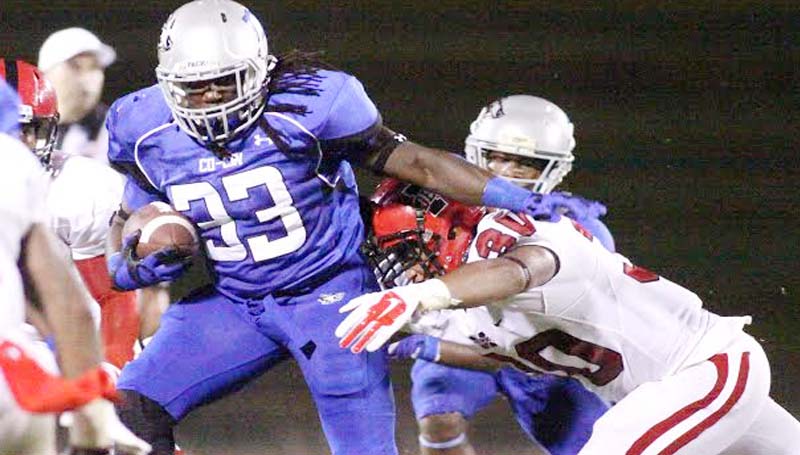 DAILY LEADER / JONATHON ALFORD / Co-Lin's sophomore running back Joshua Bates (33) uses his break away speed to deny Ms. Delta's defender Alex Johnson (30) a tackle Thursday night in JUCO action at Stone Stadium.