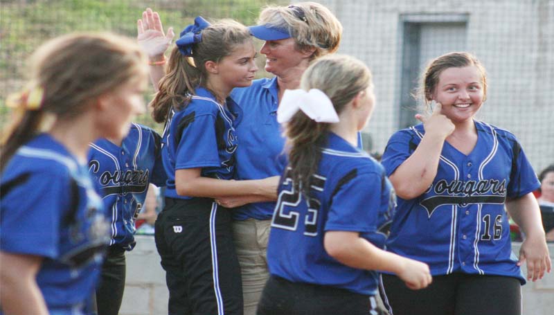 DAILY LEADER / MARTY ALBRIGHT / Coach Becky Flower and the BA Lady Cougars celebrate after winning two games Saturday to advance to Monday's semifinal in MAIS South State tournament action.