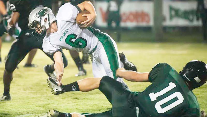DAILY LEADER / TERESA ALLRED / West Lincoln's Julian Anderson (6) would gain some positive yards before losing his footing against Pisgah Friday night.