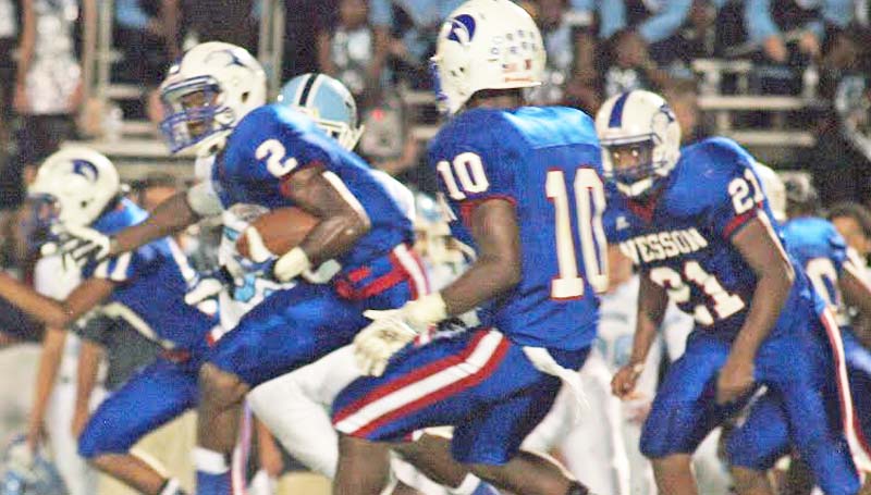 DAILY LEADER / TRACY FISCHER / Wesson's Michael Hauer (2) breaks through North Pike's defense to a positive gain as teammates Jeremiah Stapleton (10) and Demarcus Smith (21) looks on Friday night.