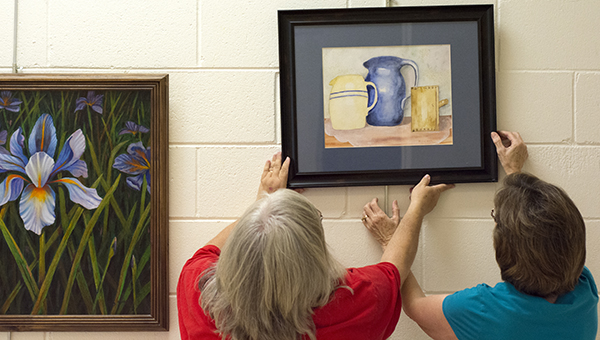 DAIILY LEADER/ KATIE WILLIAMSON / For the month of September, the library's Vernon Room will be filled with colorful artwork that includes florals, still-life works and landscapes. Miranda Moak, her mother, Mickey Moak, and her mom's sister, Debbie Whittington, are exhibiting their art. Their show is titled, "A Study of God's Blessings."