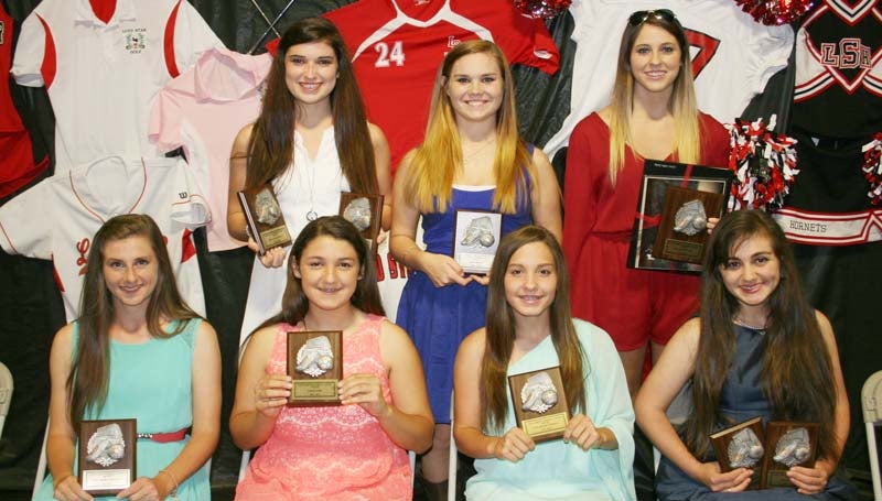 DAILY LEADER / MARTY ALBRIGHT / The Loyd Star Girls Soccer team was honored during a sports athletic banquet at the Lincoln Civic Center. Players receiving awards were (seated, from left) Lesley Walker, Most Valuable Midfielder, All-District Award; Morgyn Brister, Rookie Award; Madison Brister, Most Valuable Offense, All-District Award; Courtney Wyant, Hornet Award; (standing) Shelby Richardson, Most Valuable Defense, Coaches Award, Team Captain; Amber Archer, Most Improved; and Mallory Holden, Most Valuable Player, All-District Most Valuable Offensive Player, Team Captain.