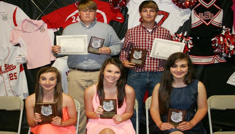 DAILY LEADER / MARTY ALBRIGHT / The Loyd Star Golf team was honored at the school's  athletic banquet. Receiving awards were (seated, from left) Madi Lewis, Most Valuable Player; Michaela Marler, Coaches Award; Courtney Wyant, Scholastic Award; (standing) Cam Harveston, District 7-2A Champions; Sawyer Norton, Most Valuable Player, District 7-2A Champions.