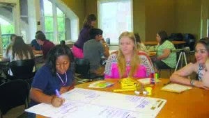 Taylor Cupit of Brookhaven (center) participates in a communications workshop held at the start of the Rural Medical Scholars program. Cupit is participating in a five-week program at Mississippi State University, where she will be completing coursework in biology and sociology, shadowing physicians and visiting the University of Mississippi Medical Center.