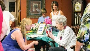 Photo by Kaitlin Mullins Nan Blakelock (left) reminisces with grandmother Joy Thomas, affectionately called  “granny mother” by family, during her 100th birthday celebration at Golden LivingCenter — Brook Manor in Brookhaven on Monday.