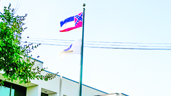 Photo by Kaitlin Mullins The Mississippi flag has come under fire for bearing the Confederate emblem since the Charleston shooting. State officials are split over whether or not to replace the flag's design.
