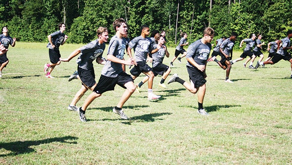 Photos by MARTY ALBRIGHT Loyd Star’s football team works on their speed and endurance in sprint drills recently.