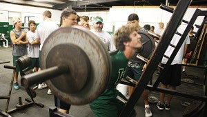 Dillan Griffin performs a squat lift during West Lincoln’s summer workout. 