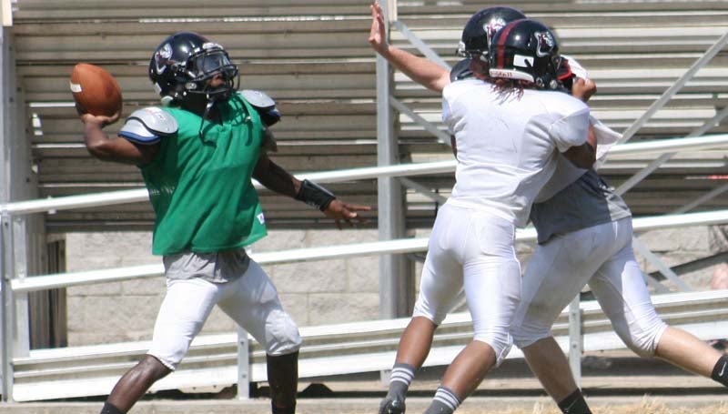 DAILY LEADER / Marty Albright / Lawrence County quarterback Charle'Tez Nunnery throws a pass down the field during a scrimmage in the first day of full gear Saturday. The Cougars will travel to Loyd Star Friday to battle the Hornets in a Fall Classic scrimmage at W.E. Smith "Sambo" Field.