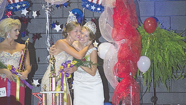 Photo by Julia V. Pendley Mattie Slade Avants (right) congratulates Mallory Denise Allen, after she was named Queen of the Lion’s Club Beauty pageant Saturday night.