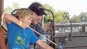 File photo A child gets an archery lesson at a previous year’s Wildlife Expo.  