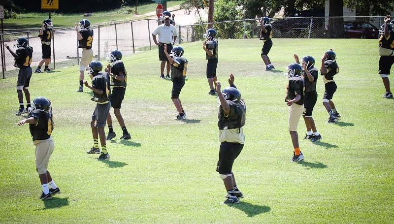 DAILY LEADER / April Clopton / Alexander's junior high football players are working hard in practice to prepare for their season opener.