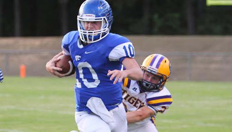 DAILY LEADER / SHERYLYN EVANS Brookhaven Academy's Madison Smith (10) escapes from a tackle as Centreville Scout Chandler (23) tries to bring him down from behind Friday night.