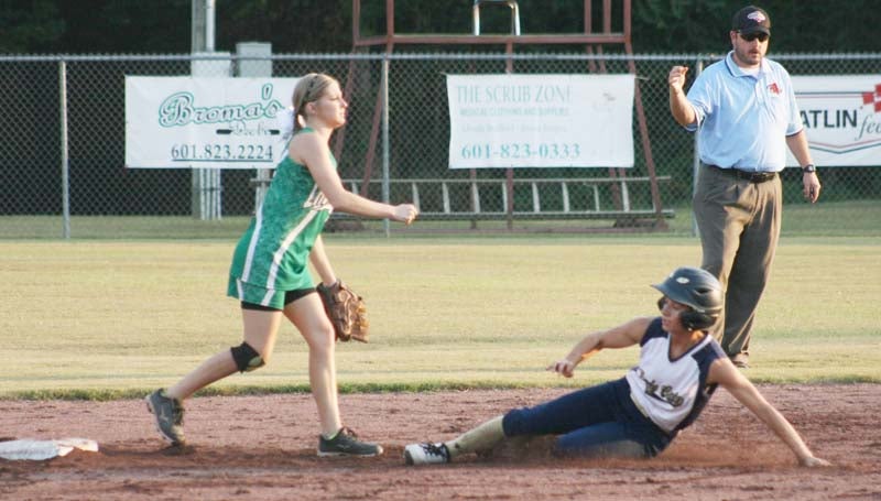 Daily Leader / Marty Albright / West Lincoln's second baseman Peyton White (left) looks to record a double play as Bogue Chitto's runner Alana Nettles slides in Tuesday night.