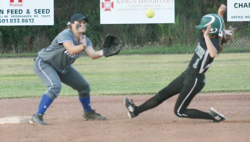 Daily Leader / Marty Albright / Brookhaven Academy's second baseman Allison Livingston waits on the throw from home plate to record the out at second base as Cathedral runner Baylee Granning (1) slides in Tuesday night.