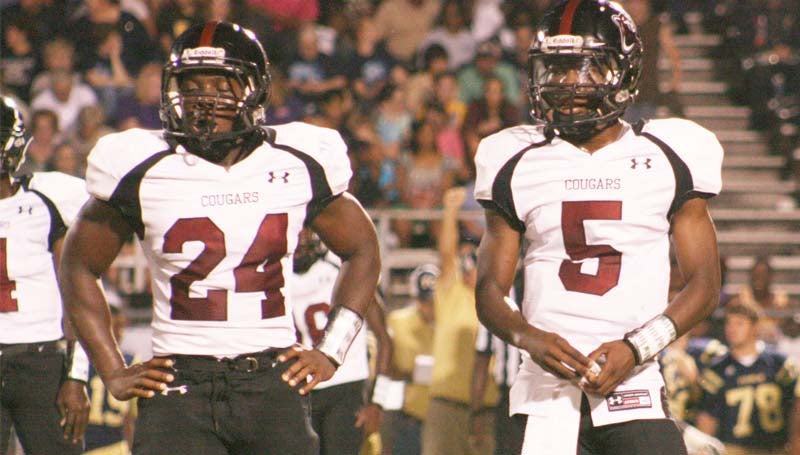 Daily Leader / Marty Albright / Lawrence County quarterback Charl'Tez Nunnery (5) and running back Quitten Brown (24) waits on the signal from the coaches in football action against Franklin County Friday night at Louie Mullins Memorial Stadium.