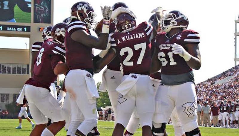Walter Frazier / For The Vicksburg Post / Mississippi State running back Aeris Williams (27) celebrates with his teammates after scoring on a 1-yard run in the first quarter Saturday against Northwestern State.