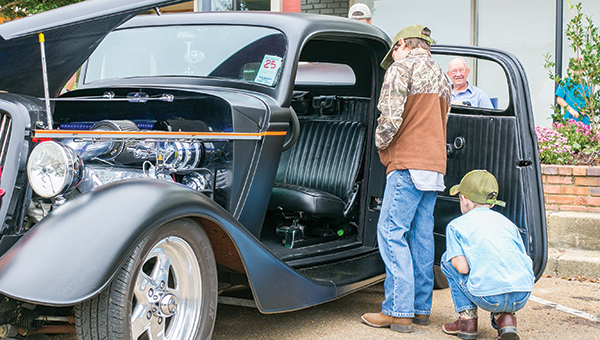Photo by Kaitlin Mullins Two young car enthusiasts inspect a vehicle at the Ole Brook Festival Car Show — a crowd favorite this past weekend. This year the car show accepted the most entries in the history of the festival, one of many aspects of the festival that made it a success.