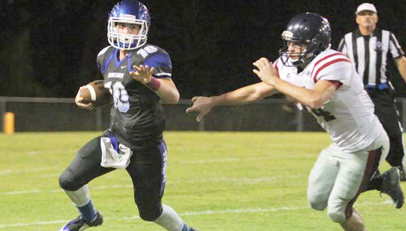 Daily Leader / Sherylyn Evans / Brookhaven Academy quarterback Madison Smith (10) runs to the outside to get away from a ASC defender Friday night at R.M. "Red" Stuard Field.