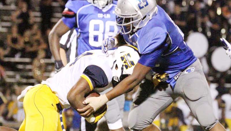 Co-Lin Media / Natalie Davis / Co-Lin linebacker Marico Page (25) tackles Gulf Coast's Ge'Vonte Jones in Thursday night JUCO action at Stone Stadium.