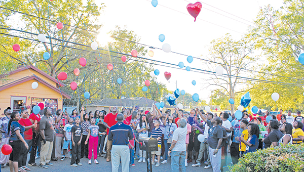Photos by Xavier Wilcher Friends, family and loved ones of the late Jevonta Dickey and Shaquan Richardson gathered to release balloons in their memory Wednesday.