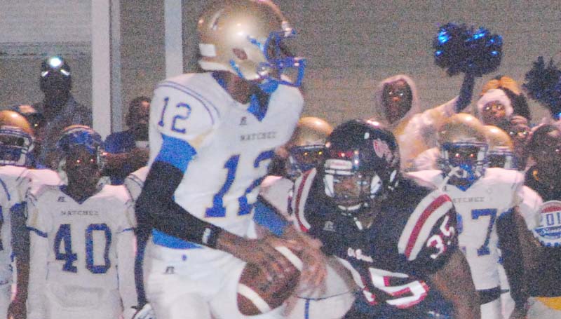 Daily Leader / Marty Albright / Brookhaven's senior linebacker Dedric Smith (35) rushes in to sack Natchez quarterback Chris Scott (12) Friday night at King Field.