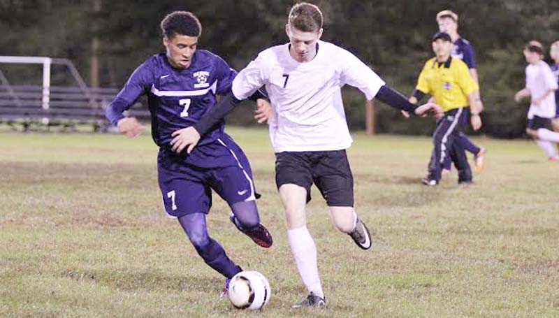 Daily Leader / Amy Rhoads / Loyd Star's Brad Jasper (7) battles against a Brookhaven’s Darius Calvin for possession of the ball Thursday night in soccer action.