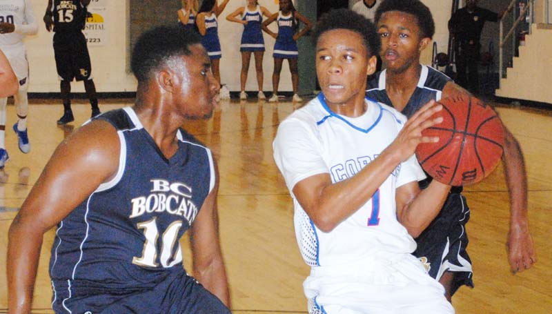 Daily Leader / Marty Albright / Wesson's guard Shemar Dickerson (1) drives in the paint for a lay up as BC's Tyler Brumfield (10) prepares to deny the shot Monday night.