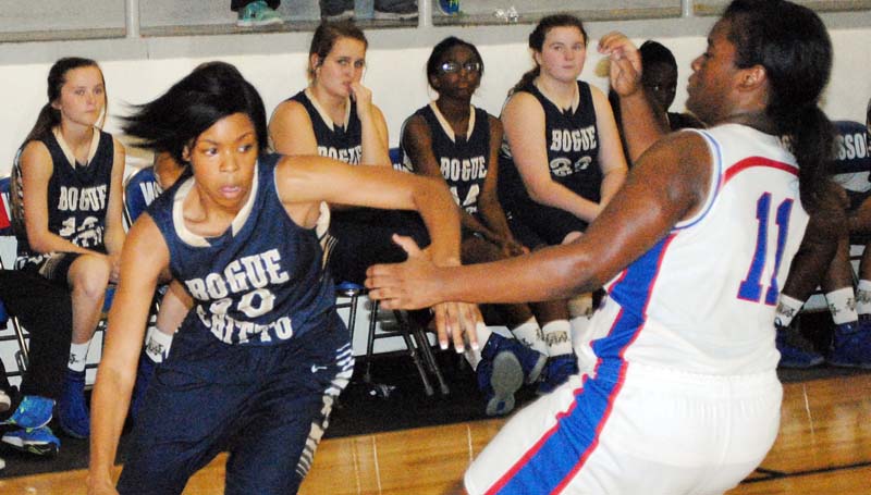 Daily Leader / Marty Albright / Bogue Chitto's Shakirianna Jefferson (10) drives by Wesson's Carnesha Green (11) in Monday night action at the Snake Pit.