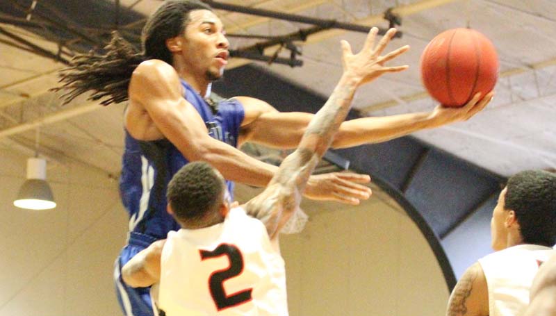 Co-Lin Media / Natalie Davis / Co-Lin's Donte Watson (24) scores two of his team-high 15 points over Baton Rouge's Paul Richard.