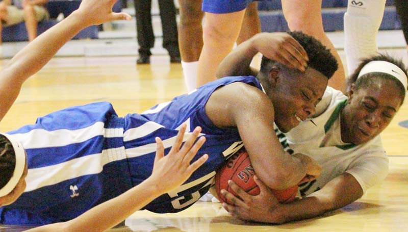 Daily Leader / Natalie Davis / Co-Lin's Alexis Collins (15) battles Pensacola State's Felicia Jackson for the loose ball.