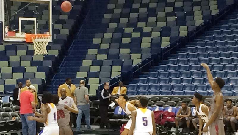 Daily Leader / photo by Tammy Carraway / Lawrence County Keyshawn Feazell (right) releases a free throw shot in Friday afternoon basketball action against Crystal Spring at Smoothie King Center in New Orleans.