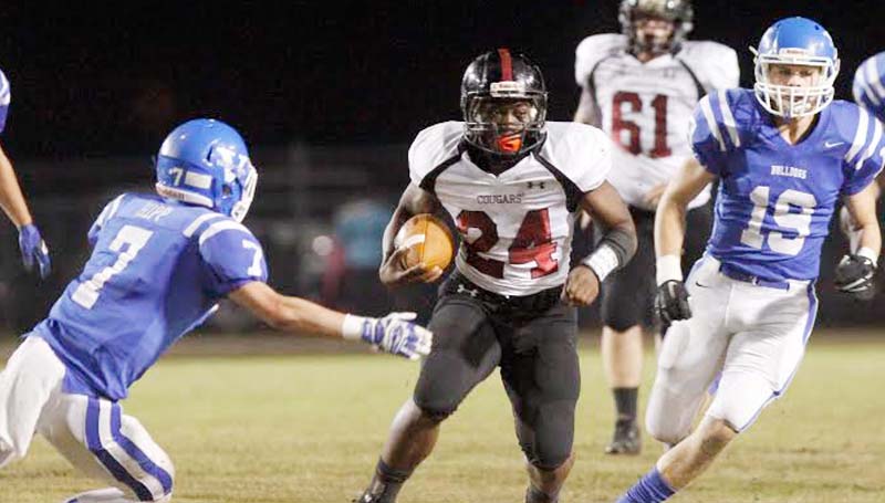 Daily Leader / Tim Isbell/SunHerald / Lawrence County running back Quitten Brown eludes an Bulldog defender Colton Hipp (7) in Friday night action at Vancleave.