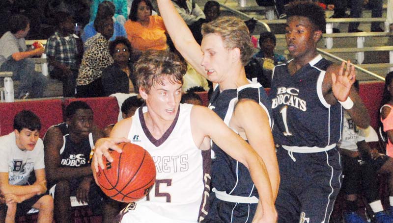 Daily Leader / Marty Albright / Enterprise's Zach Hodges (15) drives the base line to get away from the BC's pressure of Brandon McKenzie (21) and D.J. Nunnery Monday night.