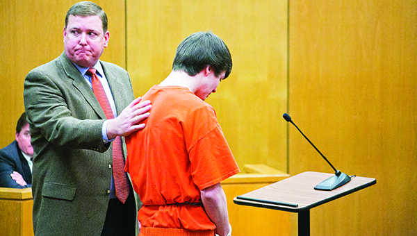 Photo by Kaitlin Mullins / Nelson Estess (left) supports Charles Acy as he makes a statement after pleading guilty to aggravated DUI homicide in the deaths of Jevonta Dickey and Shaquan Richardson. The incident took place on Oct. 14, 2014.