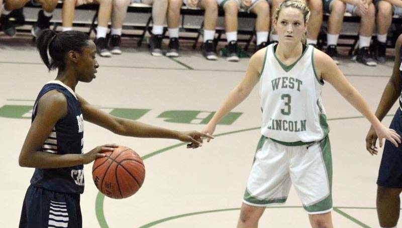 Daily Leader / Stacy Leake / Bogue Chitto's Zariah Matthews (left) points to her teammate to set a pick as West Lincoln Alli Mullins (3) defends.