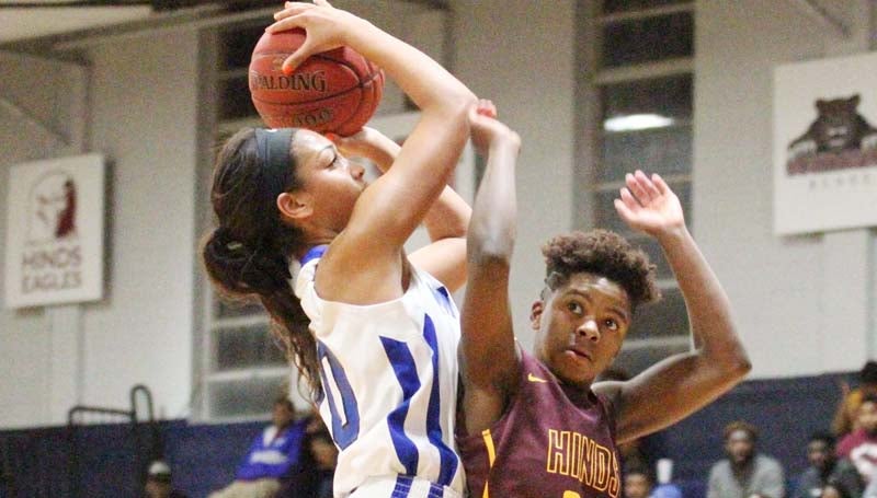Co-Lin Media / Natalie Davis / Co-Lin's Princess Cohen scores over Hinds' Annessia Durham. Cohen had 13 of her game-high 15 points in the first half.