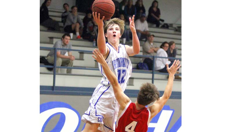 Daily Leader / Sherylyn Evans / Brookhaven Academy's Tate Felder (12) drives in for a layup over ASC's Cameron Toney Tuesday night.