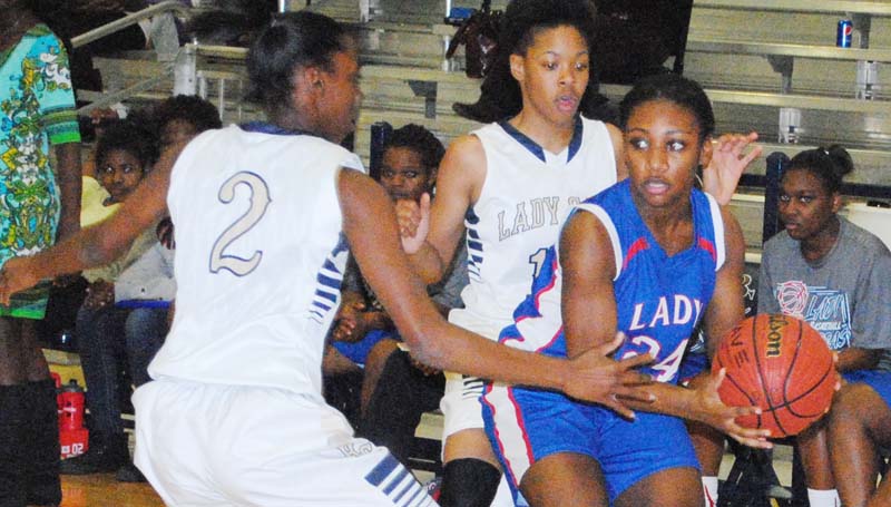 Daily Leader / Marty Albright / Bogue Chitto's Zariah Matthews (2) and Shakirianna Jefferson traps Wesson's guard Alaysha Vaughn (24) in the corner as she looks for some help Tuesday night.
